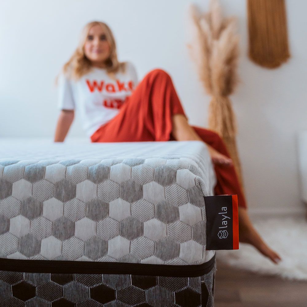 Girl Sitting on Memory Foam Mattress